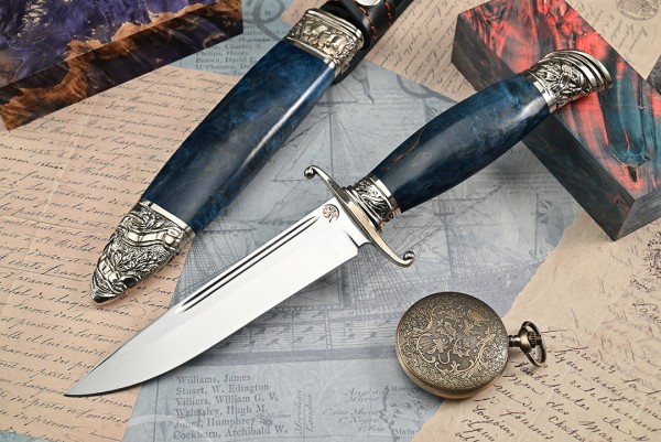 Нож Авторская Финка НКВД, клинок из стали Bohler К340, рукоять художественное литье мельхиор, стабилизированная карельская береза синяя, ножны художественное литье мельхиор, стабилизированная карельская береза